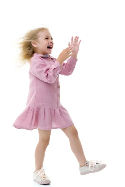 Little girl in a dress developing in the wind. — Stock Photo, Image