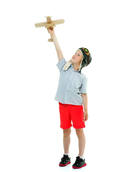 Little boy playing with wooden plane — Stock Photo, Image