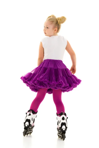 Little girl on roller skates. — Stock Photo, Image