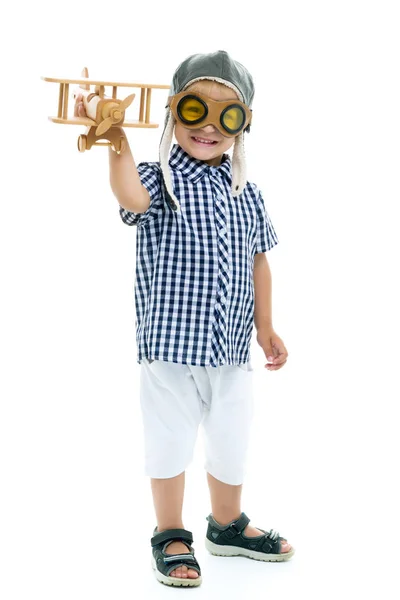 Little boy playing with wooden plane — Stock Photo, Image