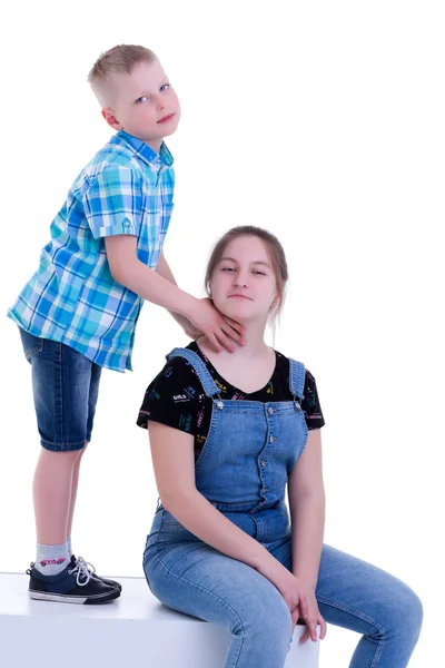 A brother and sister, a girl and a boy are photographed in a stu — Stock Photo, Image