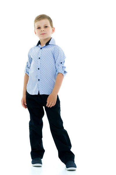 Handsome little boy in full growth on a white background. The co
