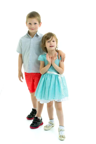 Brother and sister, boy and girl posing in the studio. Friendshi — Stock Photo, Image