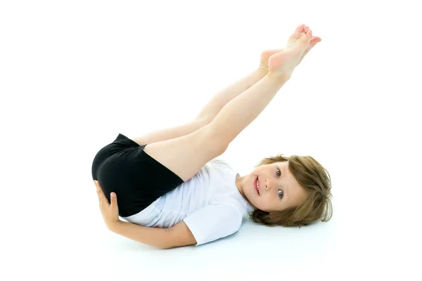 Charming little girl doing gymnastic exercises in the studio on — Stock Photo, Image