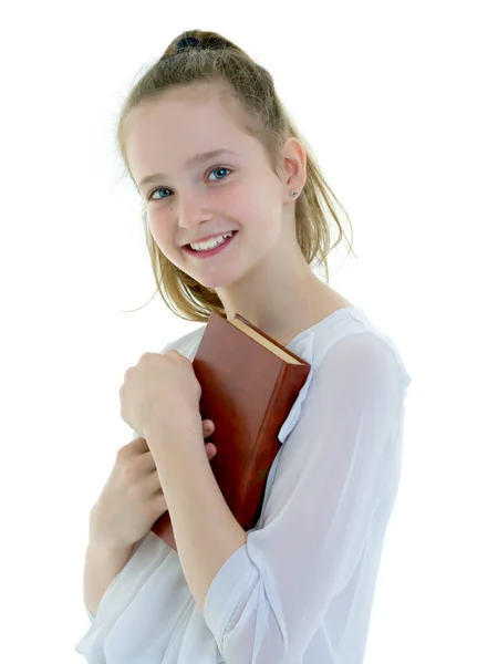 Söt liten flicka med en bok i hennes händer, begreppet Litera — Stockfoto