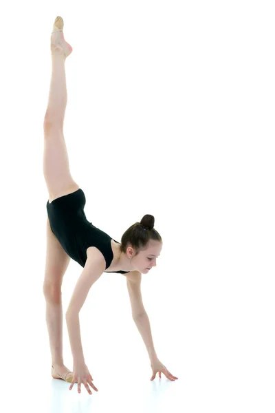 The gymnast perform an acrobatic element on the floor. — Stock Photo, Image