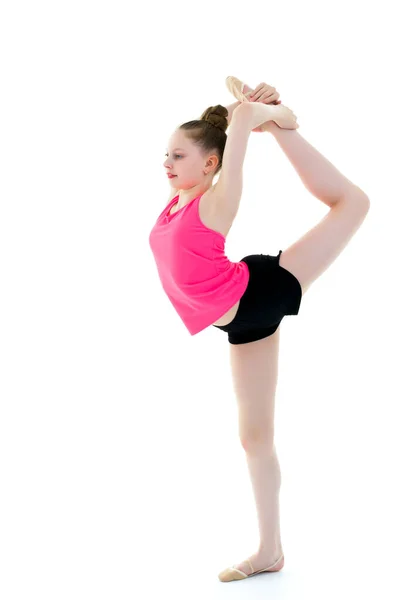 La gimnasta se equilibra en una pierna . —  Fotos de Stock