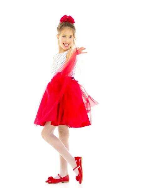 Niña en un elegante vestido.El concepto de una infancia feliz —  Fotos de Stock