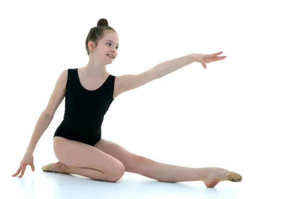 The gymnast perform an acrobatic element on the floor. — Stock Photo, Image