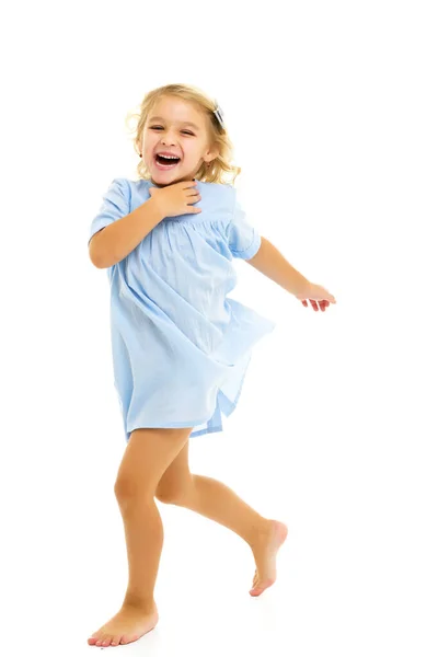 Charming little girl laughing happily in studio — Stock Photo, Image