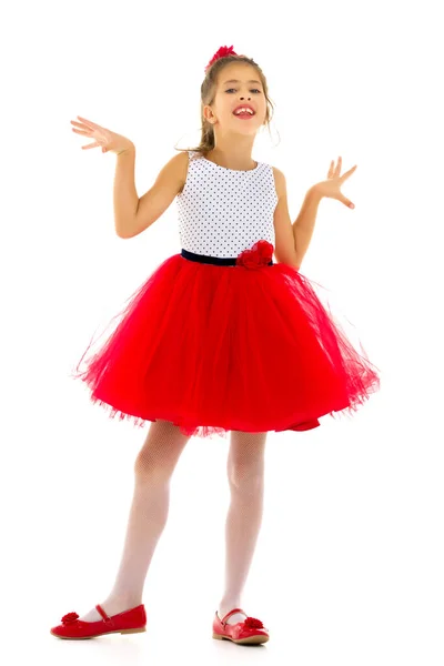 A happy little girl is waving her hand. — Stock Photo, Image