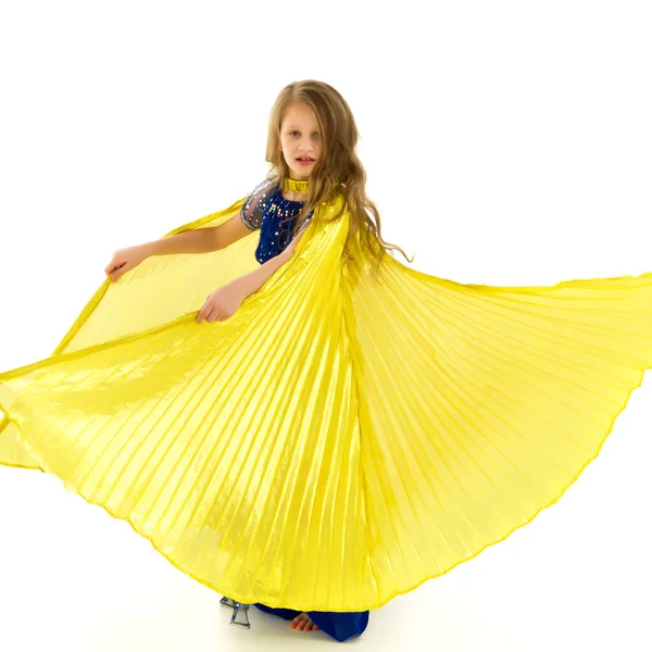 Blonde Girl in Oriental Costume Dancing Belly Dance with Wings