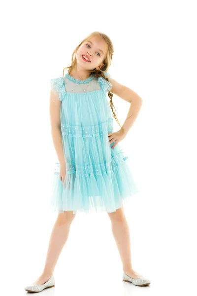 Cute little girl in a light summer dress. — Stock Photo, Image