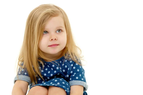 The little girl thinks.Isolated on white background. — Stock Photo, Image