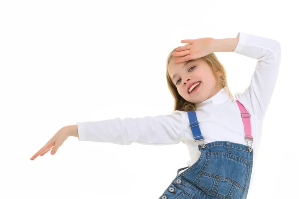 Uma menina alegre está dançando. O conceito de uma escola de dança. — Fotografia de Stock