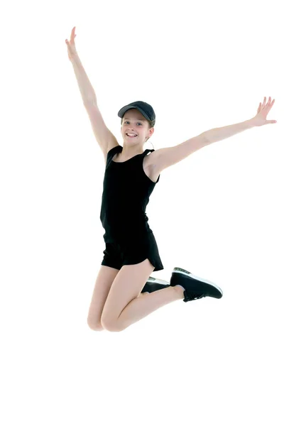Begreppet fitness, gymnastik, sporter.Flickan gymnast utför ett hopp. — Stockfoto