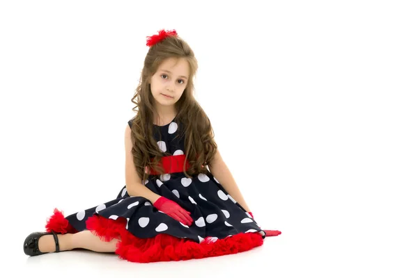 Girl in clothes in retro fashion style sitting on a white background — Stock Photo, Image