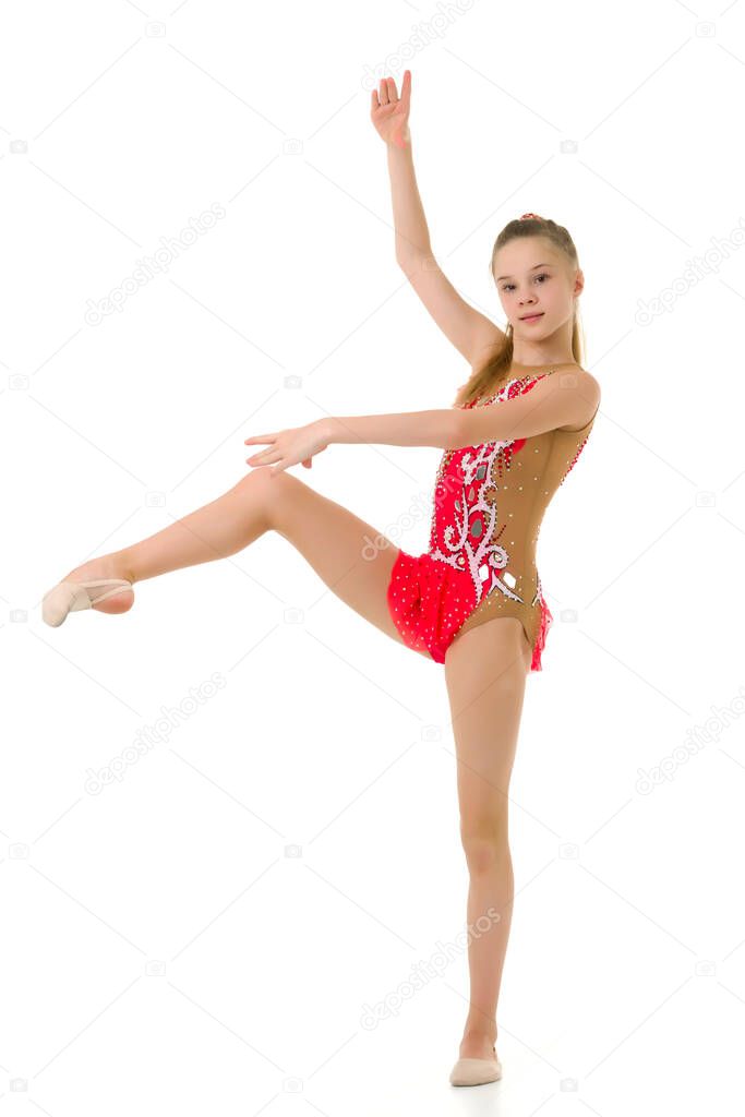 The gymnast balances on one leg.Isolated on white background.
