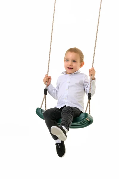 Cute Blond Boy Swinging on Rope Swing and Looking at Camera — Stock Photo, Image