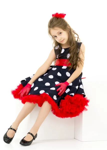 Girl in Polka Dot Dress, Red Gloves and Bow Standing Looking Awa. — Stock Photo, Image