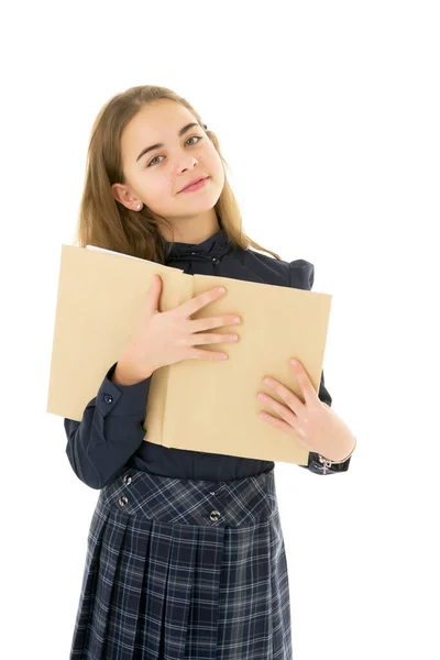 Girl schoolgirl with book.Isolated on white background. — Stock Photo, Image