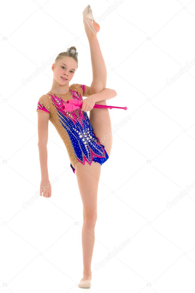 The gymnast balances on one leg.Isolated on white background.