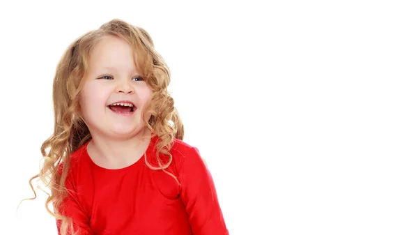 Charming little girl laughing happily in studio — Stock Photo, Image