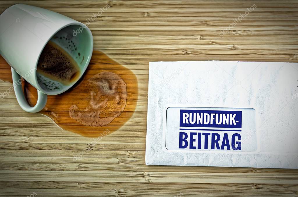Letter with in german Rundfunkbeitrag in english Radio Post and a dumped coffee cup from fright