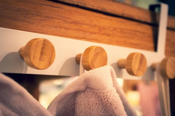 Wooden towel rack with colorful towels