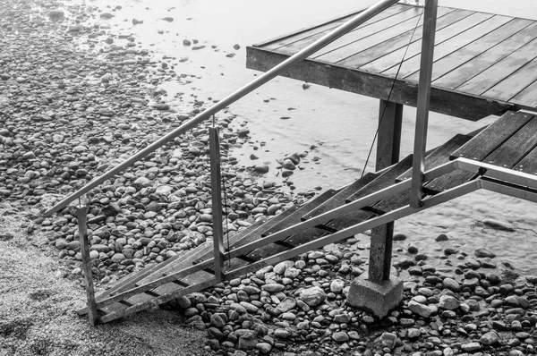 Boat dock on Lake Constance with a view of the Alps