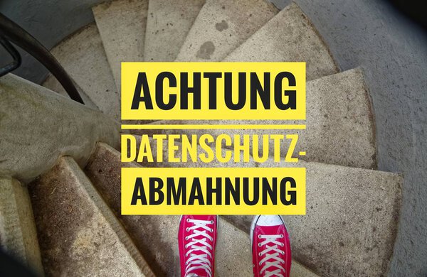 Red sneakers on spiral staircase when going downhill with in german Achtung Datenschutz Abmahnung in english Attention Privacy Notice