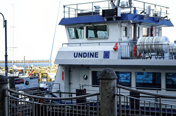 Harbor in Warnemuende with fishing boats and waves on the Baltic Sea in Mecklenburg-Vorpommern Germany Europe at night photographed on 2015.08.19