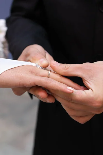 Beautiful closeup of golden wedding ring hand. Wedding ring. Happy couple.  Beautiful bride. Valentine gift.