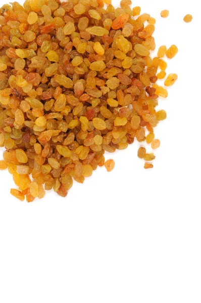 Beyaz zemin üzerine altın kuru üzüm. Yukarıdan görüntülemek.