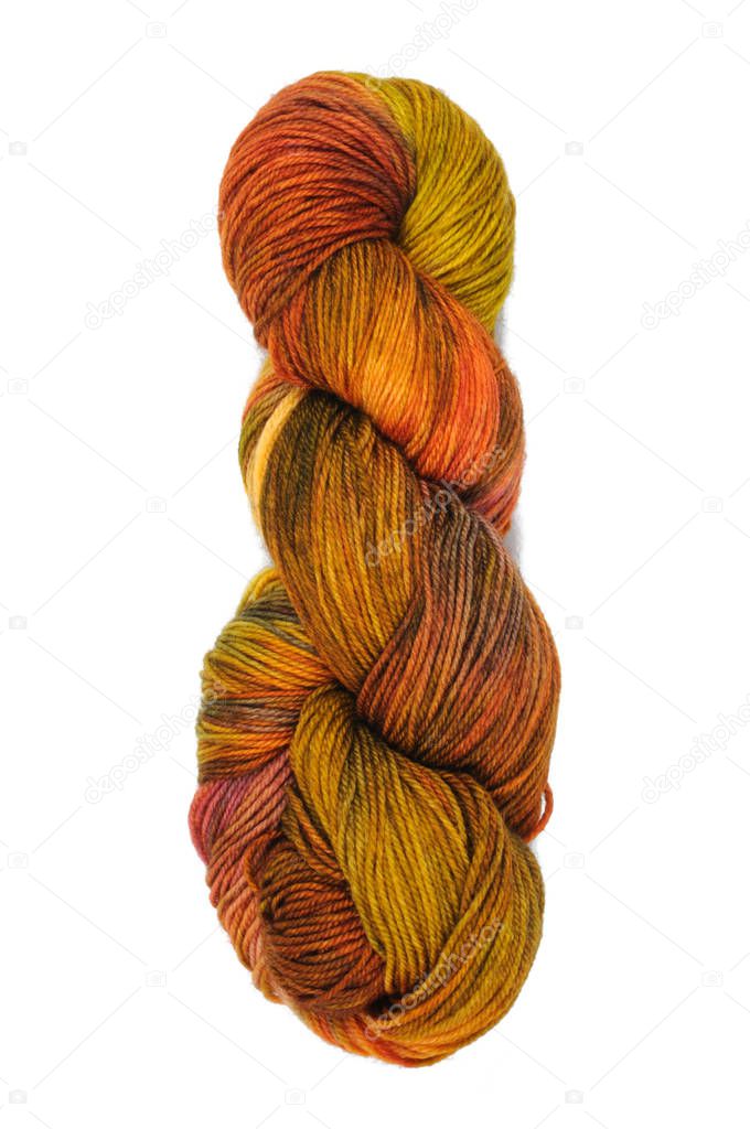 A skein of colored threads for knitting from wool isolated on a white background. View from above.