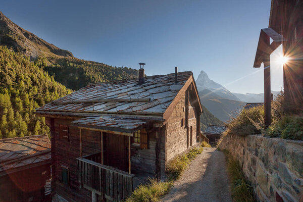 Old cottage with Matterhorn peak in Zermatt area, Switzerland