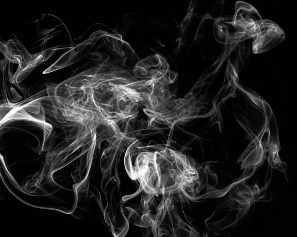 Smoke on black background in slow motion, steam mist on black