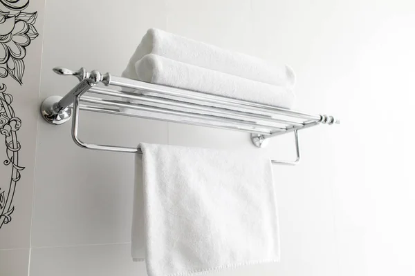 clean white towels in the hotel. Towels on a hanger