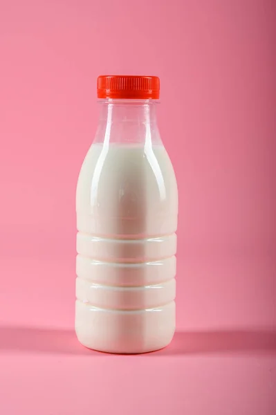 Bottle of milk on a pink background. Mock up — Stock Photo, Image