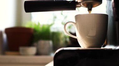 making coffee espresso. the man made coffee and took the Cup from the coffee machine