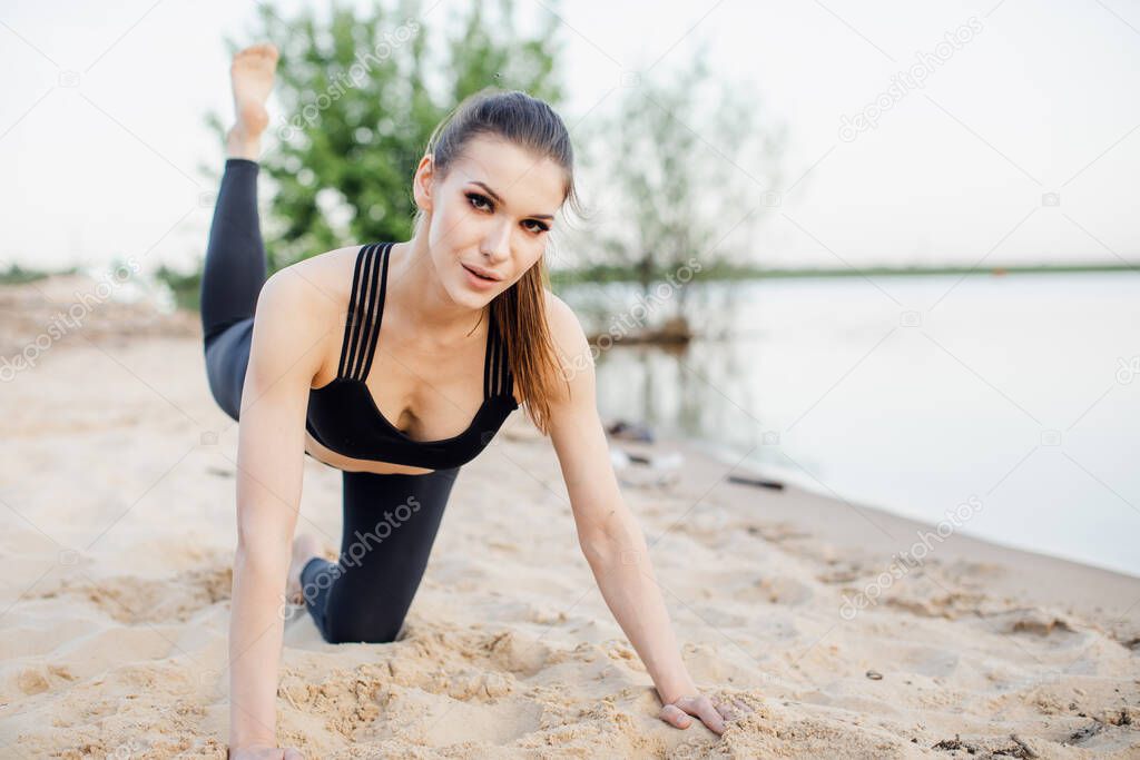 Fitness woman doing cardio interval training outdoors. Caucasian female in sportswear exercising outdoors in morning.