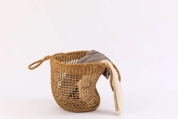 Clothes in a laundry basket isolated on white background — Stock Photo, Image