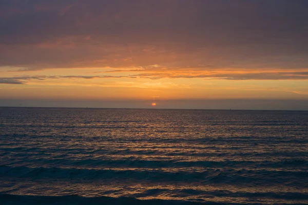 Beautiful sunset over the sea. Bright sunset sky with clouds. Black sea, Anapa, Krasnodar region, Russia