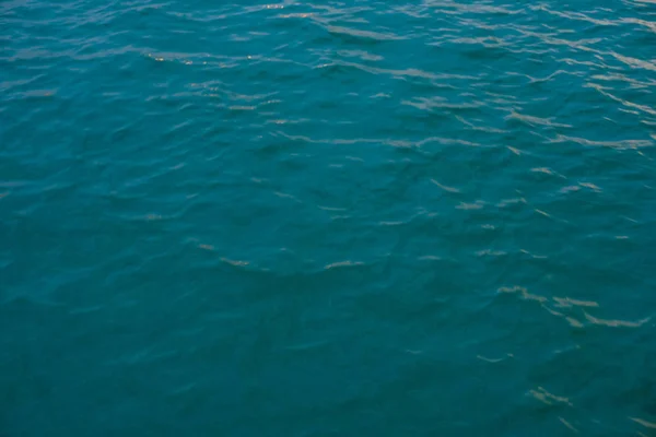 beautiful texture of sea water with shallow wave, top view. thick blue-turquoise color.