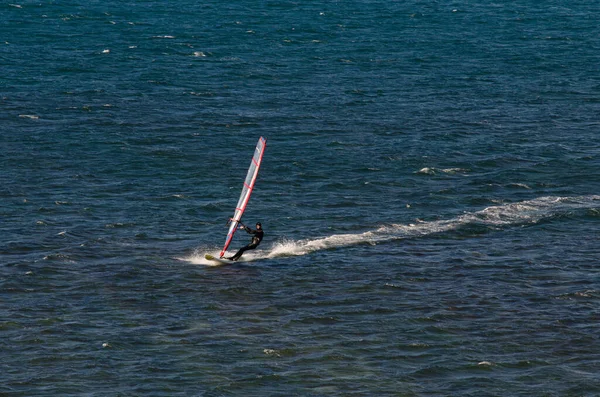 Anapa, Russia-June 15, 2020: Recreational Water Sports. Windsurfing. Windsurfer Surfing The Wind On Waves In Ocean, Sea. Extreme Sport Action. Recreational Sporting Activity. Healthy Lifestyle — Stock Photo, Image