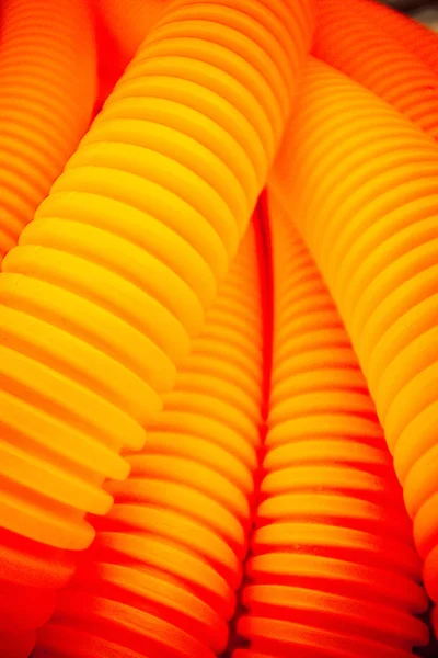 vivid orange plastic tubes