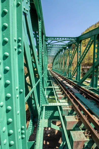 green color train bridge left side