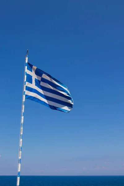 greek flag waving in the sky