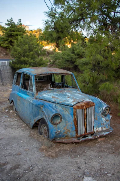 old car next to the road