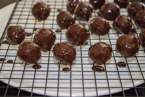 a few chocolate balls on iron net